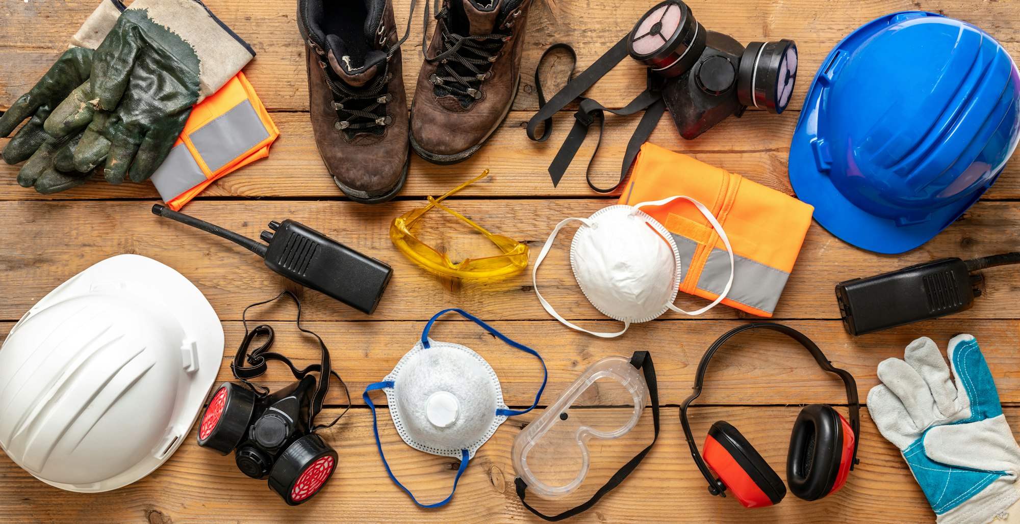 Work health and safety flat lay. Labor personal protective gear for industry and construction site.