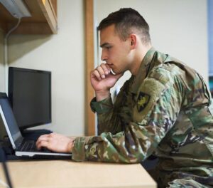 education decision process for military-connected learner using laptop
